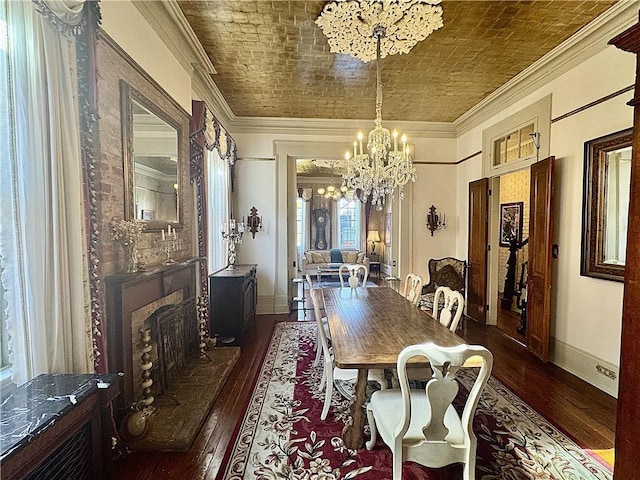 dining room with hardwood / wood-style floors, brick ceiling, a notable chandelier, and ornamental molding