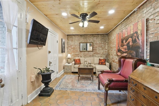 sitting room with recessed lighting, wood ceiling, brick wall, and a ceiling fan