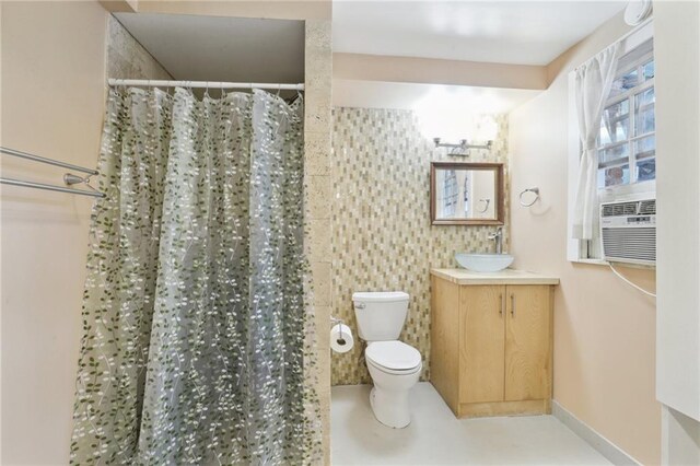 full bathroom featuring curtained shower, toilet, tile walls, and vanity