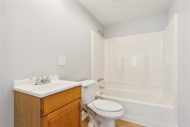 full bathroom with washtub / shower combination, tile patterned flooring, vanity, and toilet