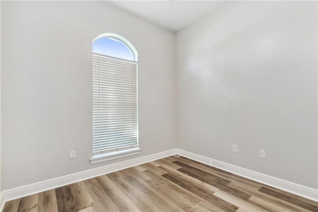 empty room with light hardwood / wood-style floors