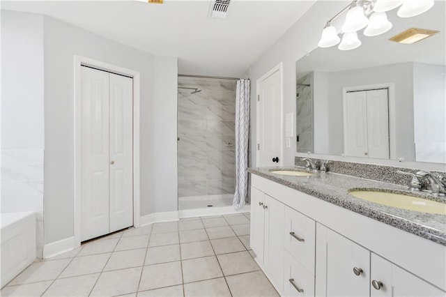 bathroom featuring a shower with shower curtain, vanity, and tile patterned floors