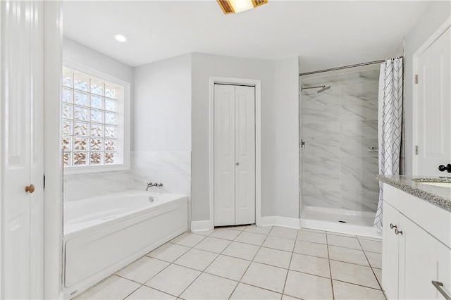 bathroom featuring tile patterned floors, vanity, and independent shower and bath