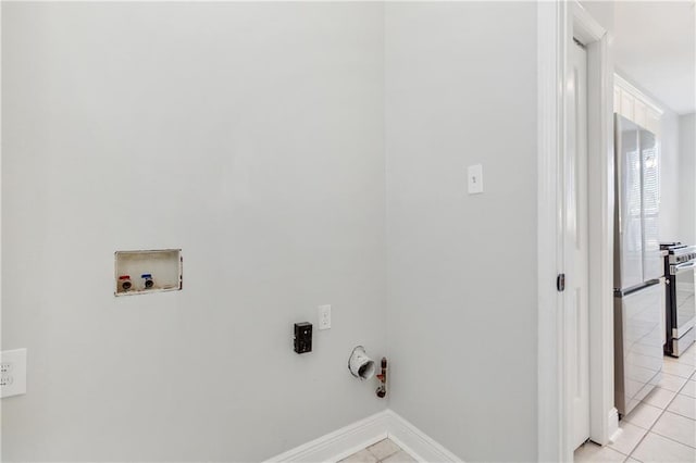 laundry room with hookup for a washing machine, hookup for a gas dryer, and light tile patterned floors