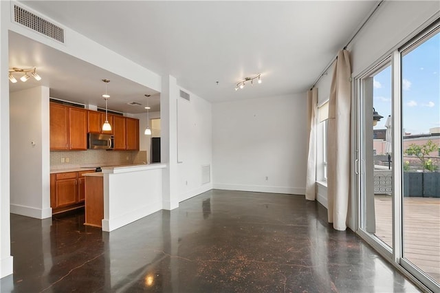 kitchen with decorative light fixtures and decorative backsplash