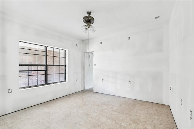 spare room featuring a ceiling fan