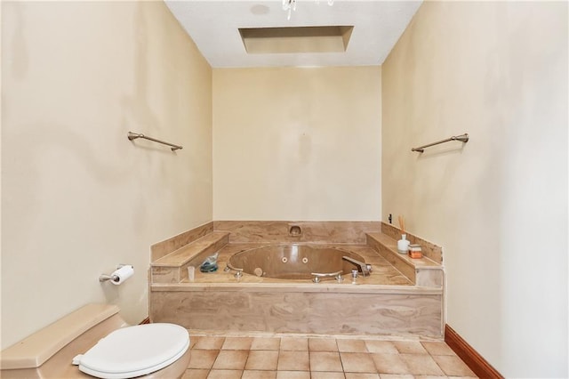 bathroom with toilet, a jetted tub, and tile patterned floors