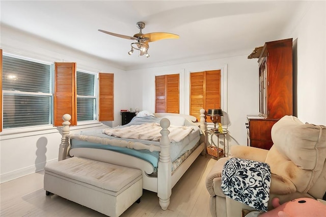 bedroom featuring ceiling fan and light hardwood / wood-style flooring