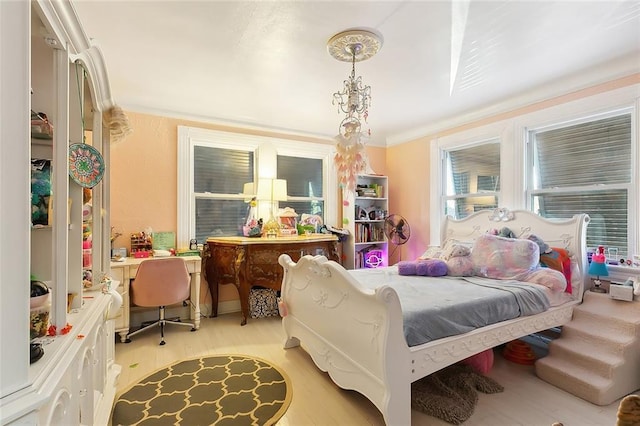 bedroom featuring crown molding and light hardwood / wood-style flooring