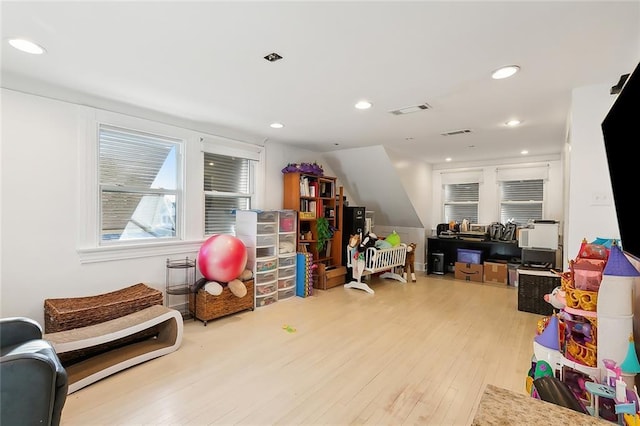 game room with light wood-type flooring