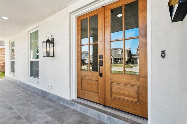 doorway to property featuring a porch