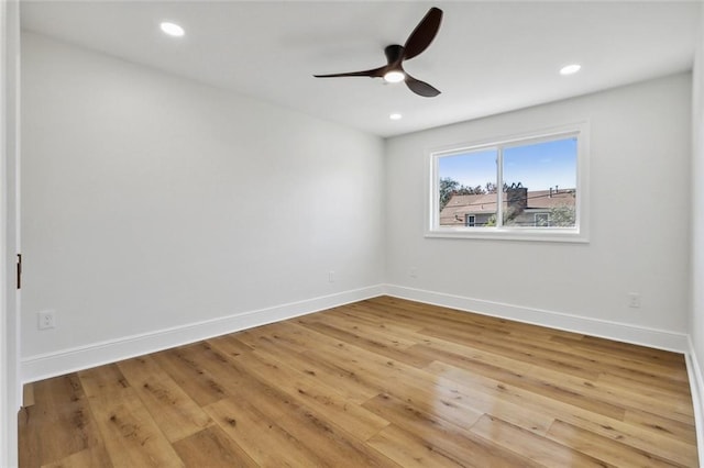 unfurnished room with light wood-type flooring and ceiling fan