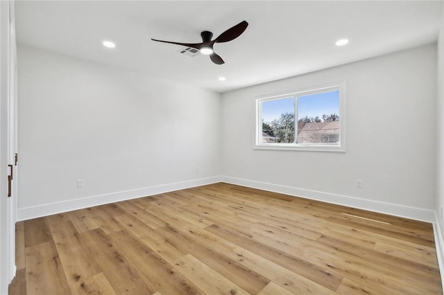 unfurnished room with ceiling fan and light hardwood / wood-style flooring