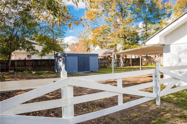 view of gate featuring a shed