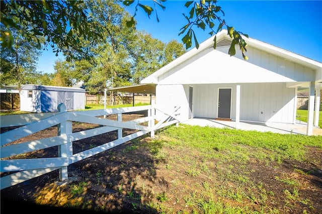 back of property with a storage unit