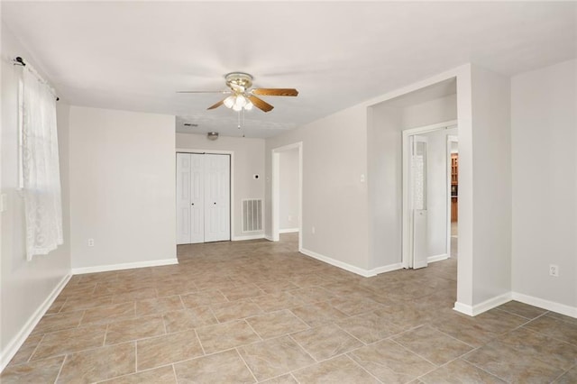 spare room with ceiling fan