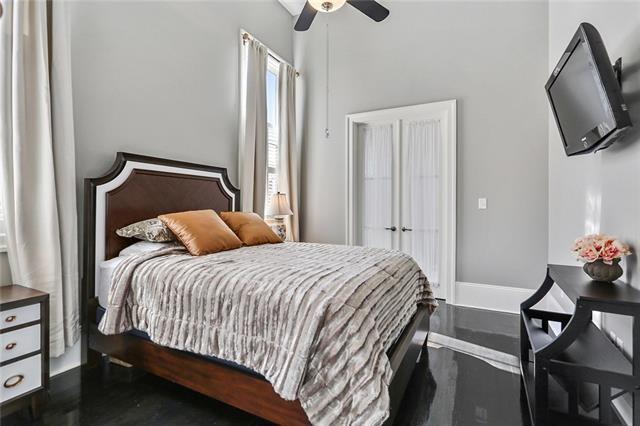 bedroom with hardwood / wood-style flooring and ceiling fan