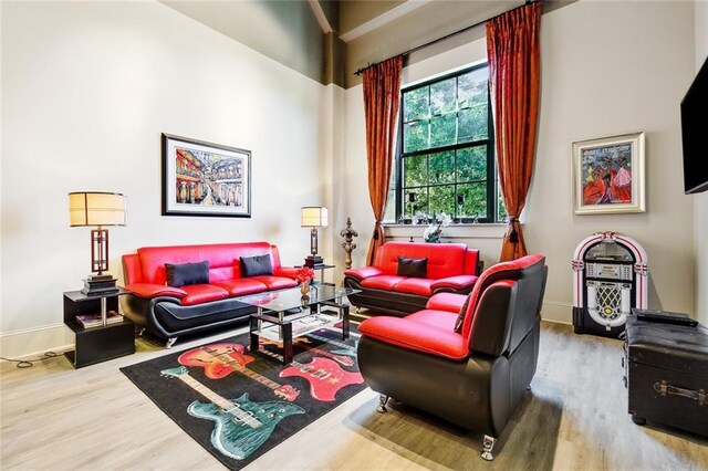 1201 Canal St Unit 271, New Orleans, LA 70112 - living area featuring wood finished floors and baseboards