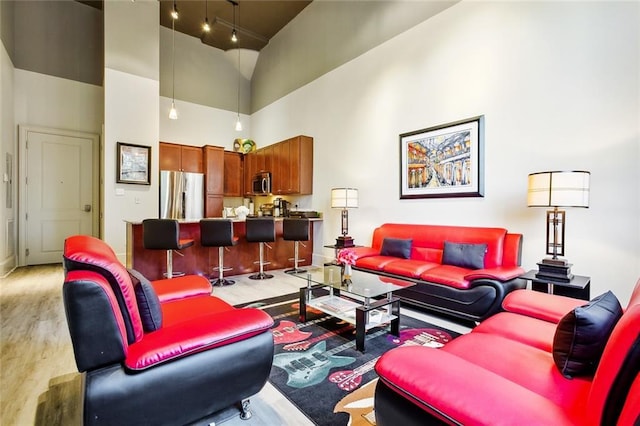 1201 Canal St Unit 271, New Orleans, LA 70112 - living area featuring light wood finished floors and a high ceiling