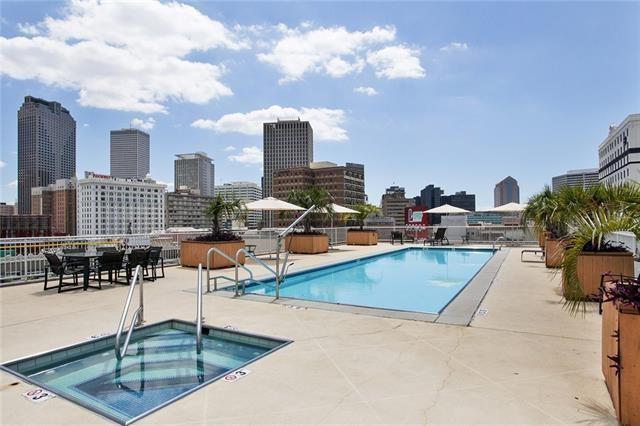 1201 Canal St Unit 271, New Orleans, LA 70112 - community pool with a hot tub, a patio, and a view of skyline