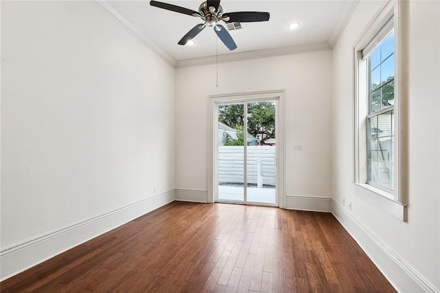 unfurnished room featuring ornamental molding, ceiling fan, and dark wood-type flooring