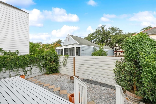 view of property exterior featuring a sunroom