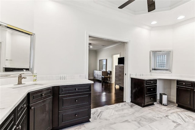 bathroom featuring vanity, ornamental molding, and ceiling fan