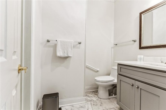 bathroom with toilet and vanity