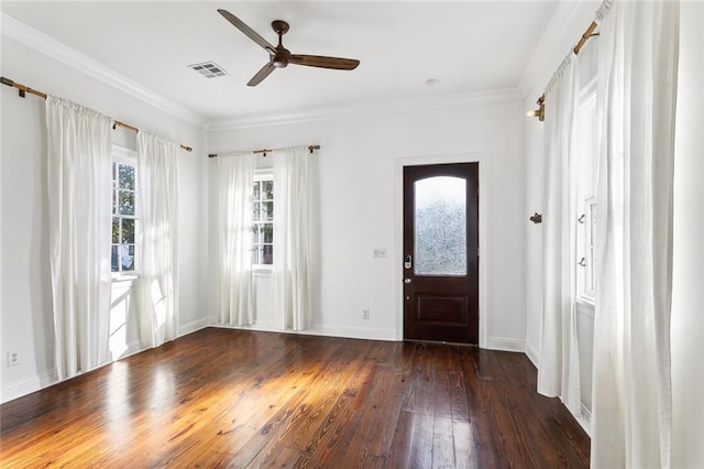 foyer featuring ceiling fan, dark hardwood / wood-style flooring, and ornamental molding