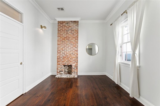 unfurnished living room with a fireplace, crown molding, and dark wood-type flooring