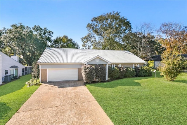 view of front of home featuring cooling unit and a front lawn