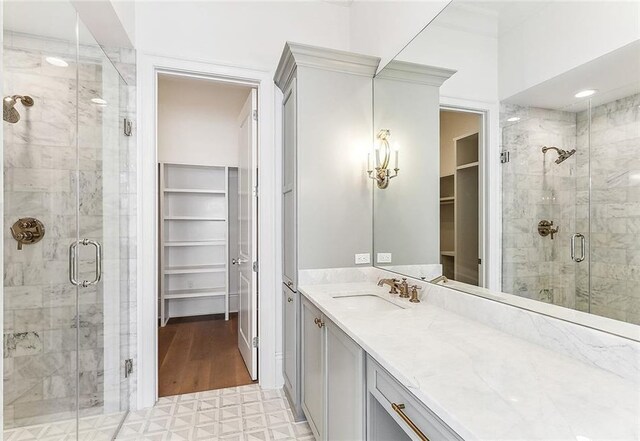 bathroom with vanity and walk in shower