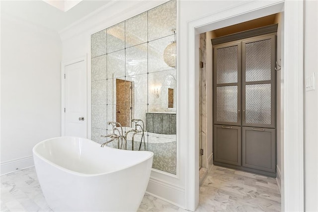 bathroom featuring a bathtub and ornamental molding