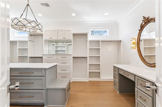 walk in closet featuring light wood-type flooring