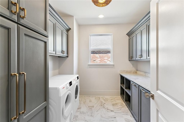 laundry area with cabinets and washing machine and dryer