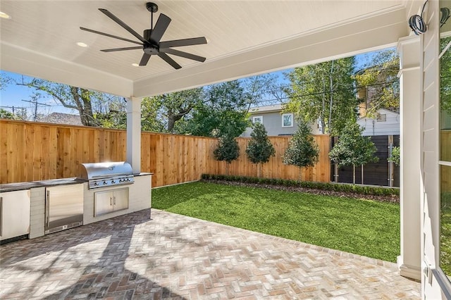 view of patio / terrace featuring area for grilling and ceiling fan