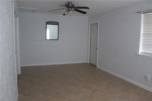 spare room featuring ceiling fan