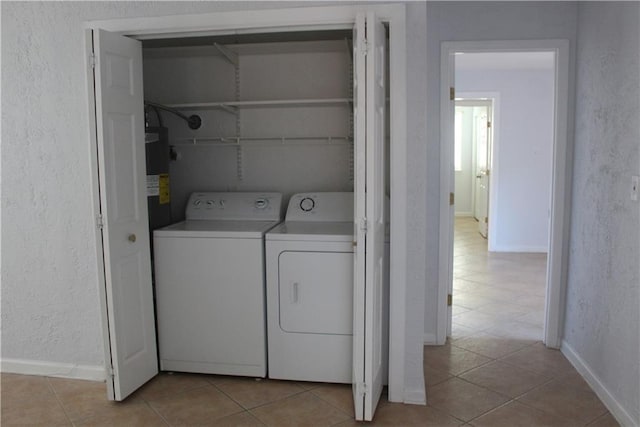 washroom featuring light tile patterned flooring and separate washer and dryer