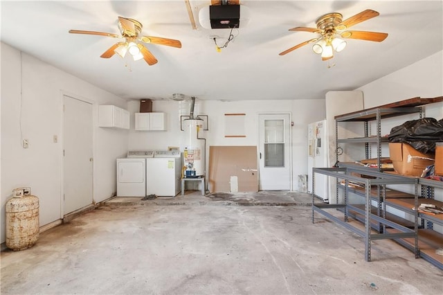 garage with ceiling fan, a garage door opener, washer and clothes dryer, and water heater