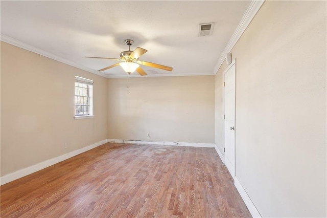 spare room with wood-type flooring, ceiling fan, and ornamental molding