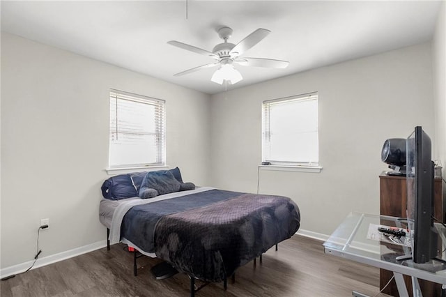 bedroom featuring hardwood / wood-style flooring and ceiling fan