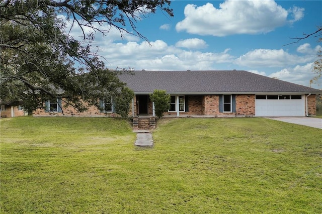 single story home featuring a front yard and a garage