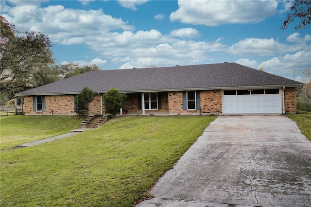 ranch-style house featuring a front yard and a garage