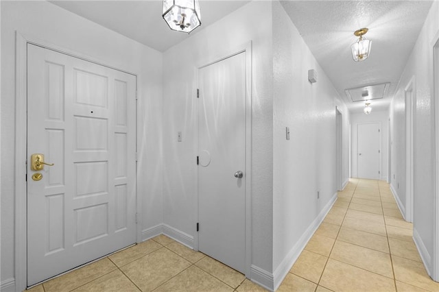 corridor featuring light tile patterned floors