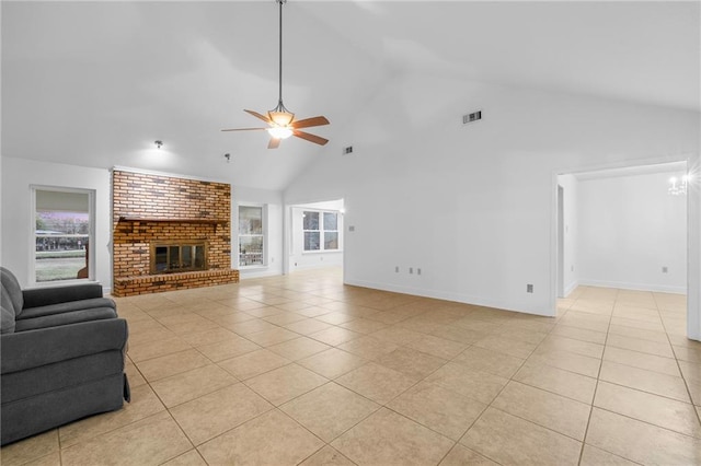 living room with ceiling fan, light tile patterned floors, high vaulted ceiling, and a brick fireplace