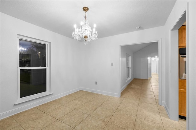 unfurnished dining area with a notable chandelier and light tile patterned floors