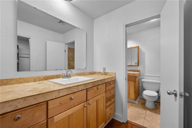 34222 Laurent Rd, Slidell, LA 70460 - bathroom featuring a textured wall and vanity