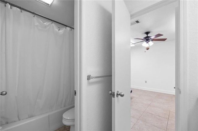 bathroom with toilet, ceiling fan, tile patterned flooring, and shower / tub combo with curtain