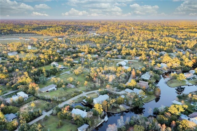 34222 Laurent Rd, Slidell, LA 70460 - aerial view of property's location featuring a nearby body of water and a heavily wooded area