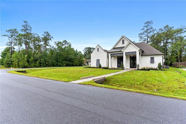 modern farmhouse with a front lawn